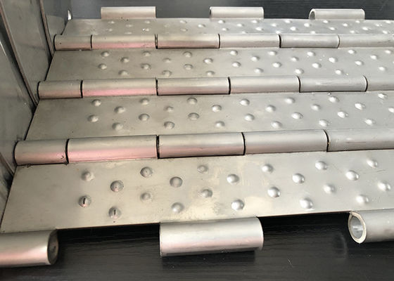 Perbandingan konveyor lempeng tahan suhu tinggi Produksi pelet kayu